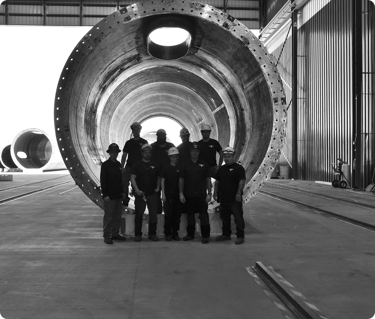 Group inside giant metal tunnel structure